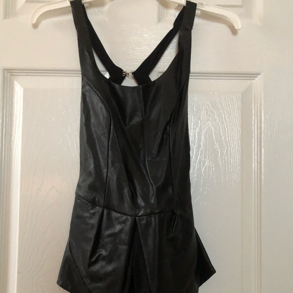 Black leather peplum top with a cutout back